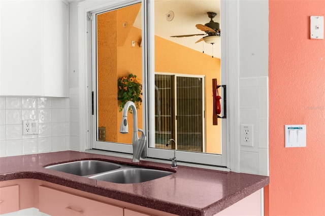 kitchen featuring sink, backsplash, and ceiling fan