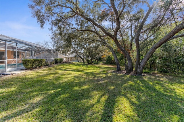 view of yard featuring a lanai