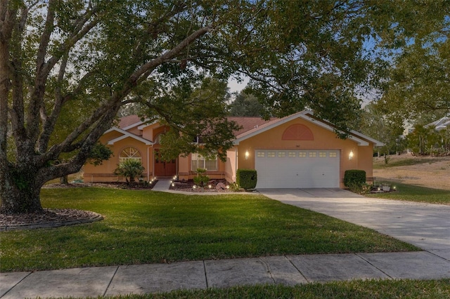 ranch-style home featuring a garage and a front lawn