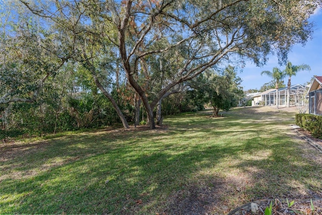 view of yard with a lanai