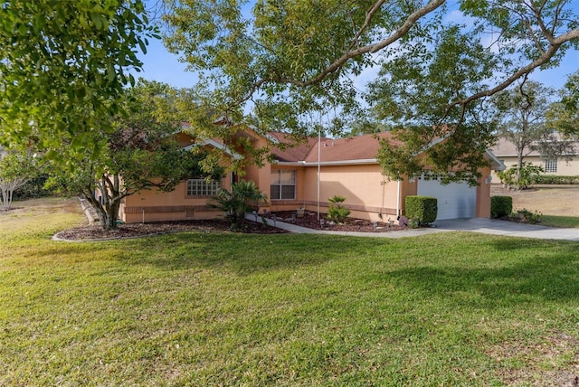 view of front of home with a garage and a front lawn