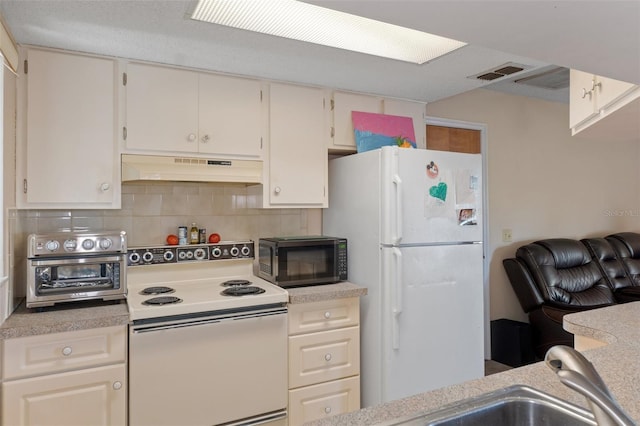 kitchen featuring white cabinetry, sink, backsplash, and white appliances