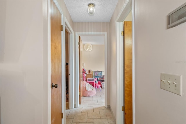 corridor with a textured ceiling