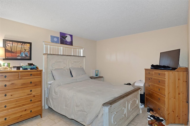 bedroom featuring a textured ceiling