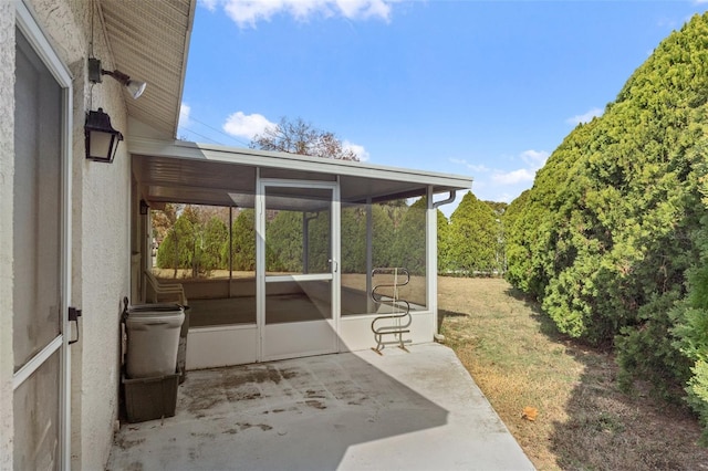 view of patio with a sunroom