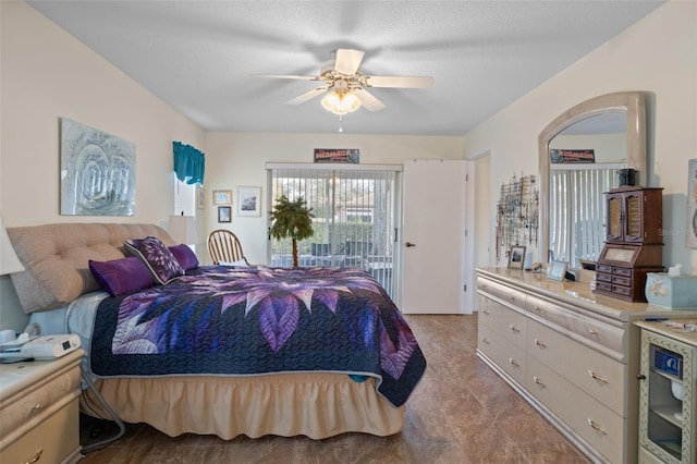 bedroom featuring access to exterior and ceiling fan