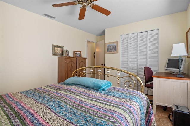 bedroom featuring carpet, ceiling fan, and a closet