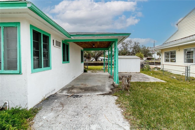 exterior space featuring a patio area and a shed