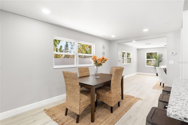 dining area with light wood-type flooring