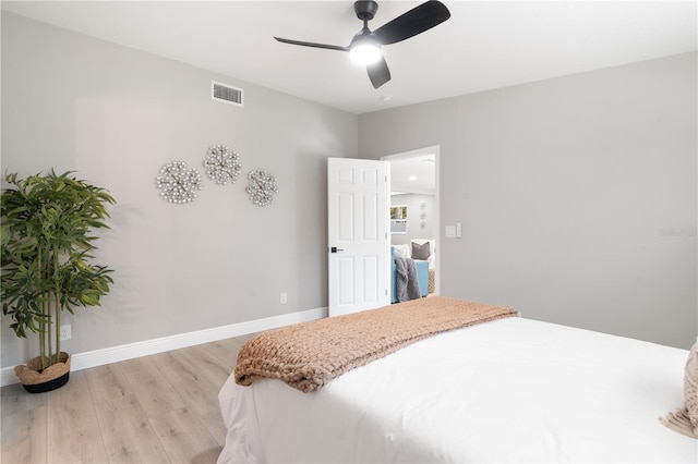 bedroom with ceiling fan and light hardwood / wood-style floors