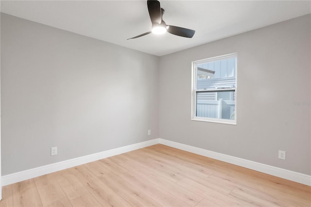 empty room with light hardwood / wood-style floors and ceiling fan