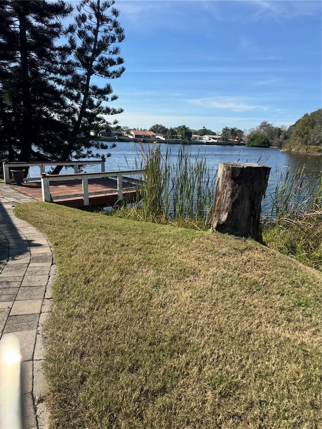 exterior space featuring a water view and a yard