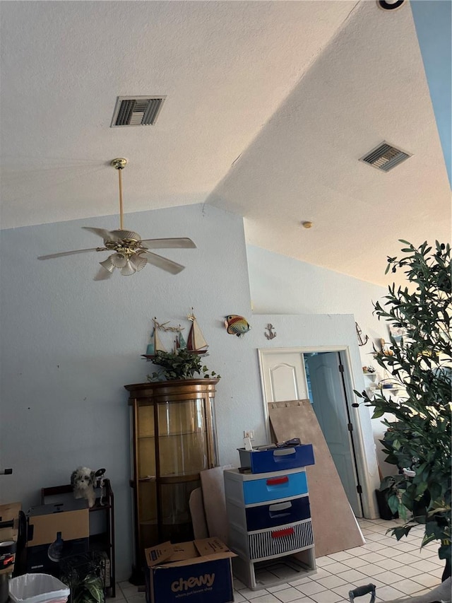 interior details with ceiling fan and a textured ceiling