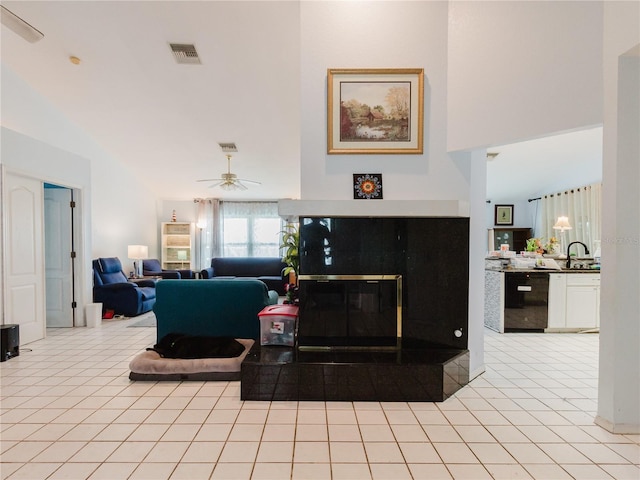 5771 Catskill Rd, Holiday, FL 34690 - living room featuring light tile patterned floors, a ceiling fan, and visible vents