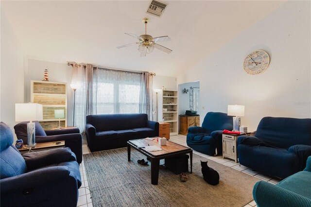 5771 Catskill Rd, Holiday, FL 34690 - living room with light tile patterned floors, ceiling fan, high vaulted ceiling, and visible vents