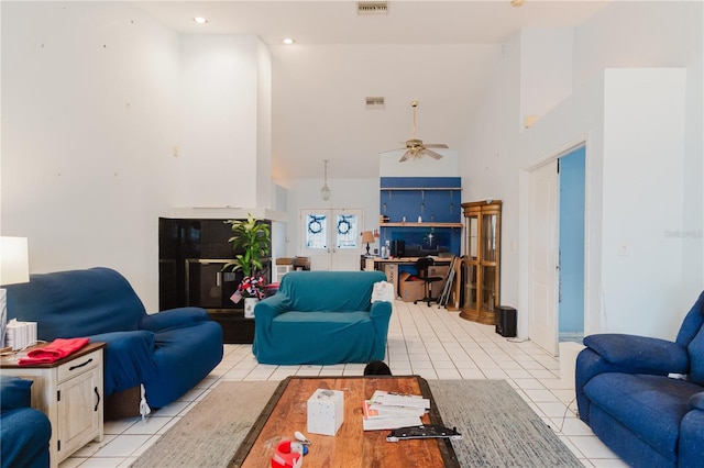 5771 Catskill Rd, Holiday, FL 34690 - living room with ceiling fan, visible vents, a high ceiling, light tile patterned flooring, and french doors