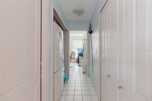 5771 Catskill Rd, Holiday, FL 34690 - corridor featuring light tile patterned floors