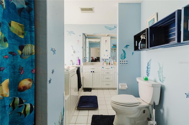 5771 Catskill Rd, Holiday, FL 34690 - full bath featuring visible vents, a shower with curtain, toilet, vanity, and tile patterned floors