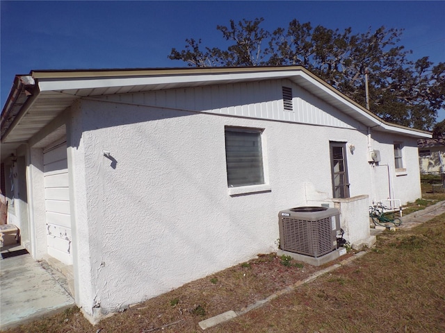 view of home's exterior with central AC unit