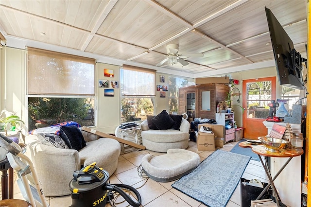 living area featuring a ceiling fan, wood ceiling, and light tile patterned flooring