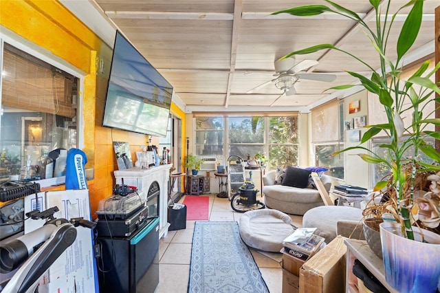 sunroom / solarium featuring a ceiling fan