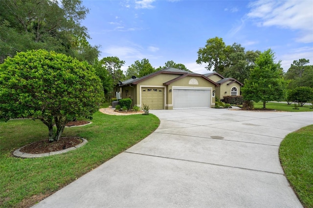 single story home featuring a garage and a front yard