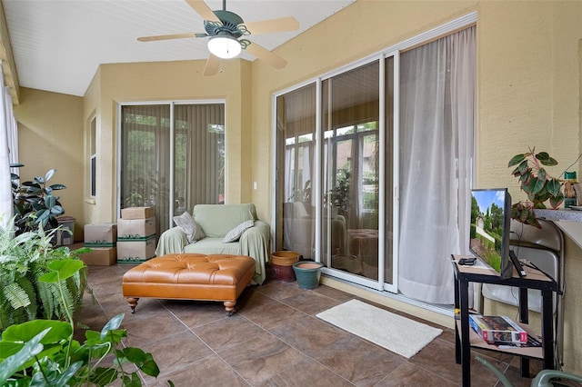 sunroom / solarium with ceiling fan