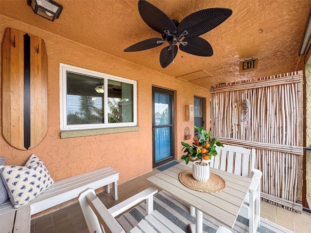 view of patio / terrace featuring ceiling fan