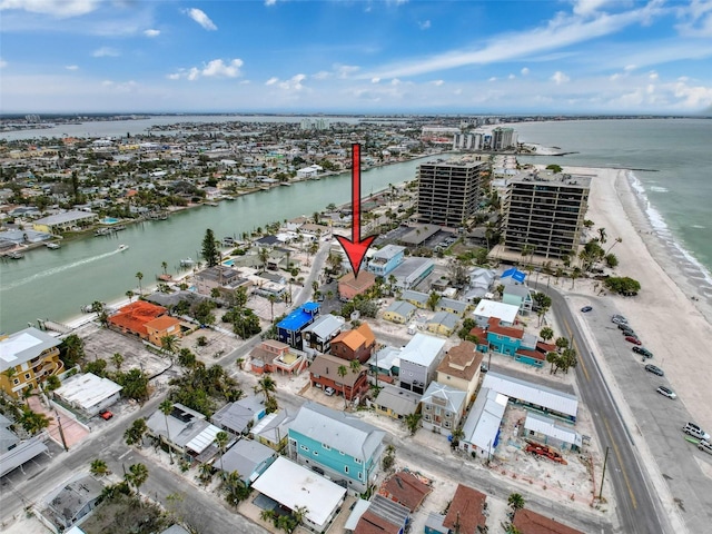 bird's eye view featuring a water view and a beach view