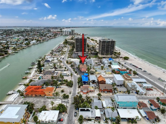 birds eye view of property featuring a view of the beach and a water view