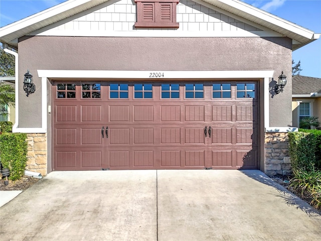 garage featuring driveway