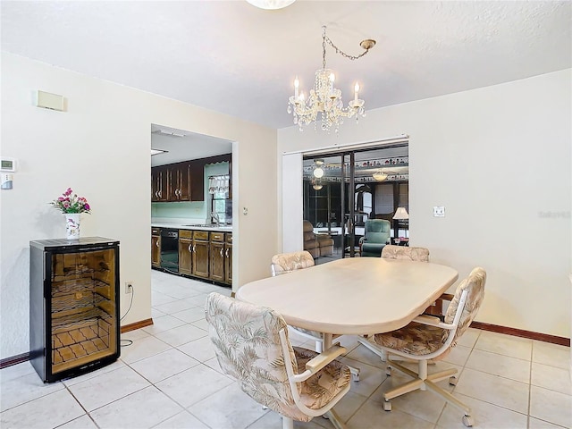 tiled dining area with a notable chandelier, sink, and beverage cooler