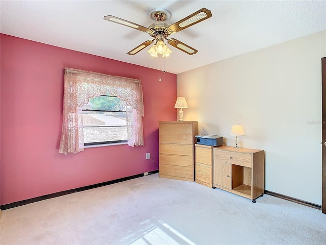 unfurnished bedroom featuring ceiling fan and light colored carpet