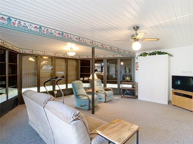 living room featuring carpet and ceiling fan