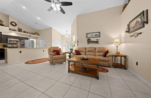 tiled living room with ceiling fan and high vaulted ceiling