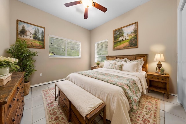 bedroom featuring baseboard heating, ceiling fan, and light tile patterned floors