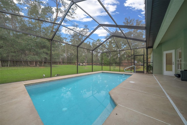 view of swimming pool with a patio, a yard, and glass enclosure