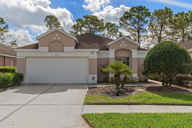 view of front of property with a garage, driveway, a shingled roof, and stucco siding