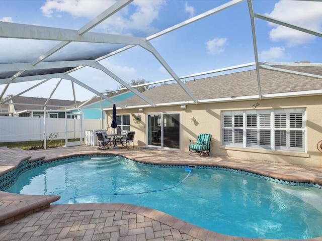 view of pool with a patio and a lanai