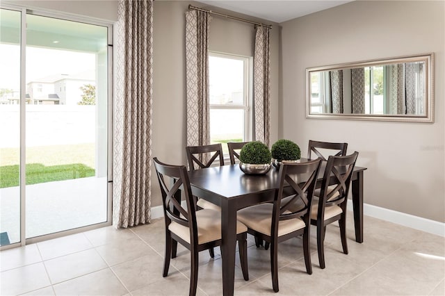 dining space with light tile patterned floors