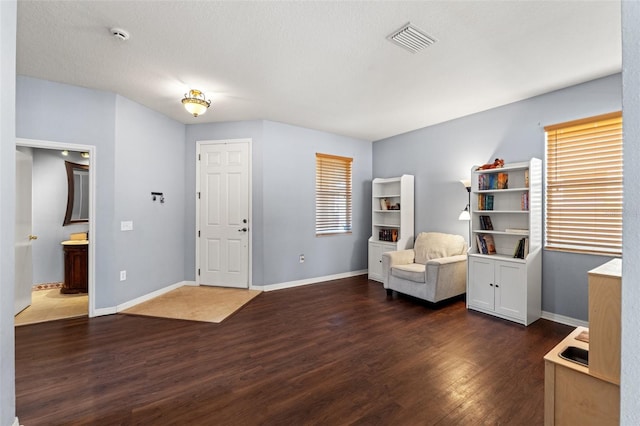 sitting room featuring dark hardwood / wood-style flooring