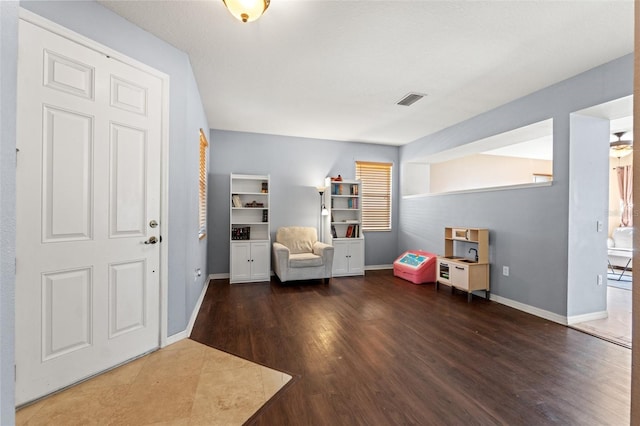 interior space with dark hardwood / wood-style flooring