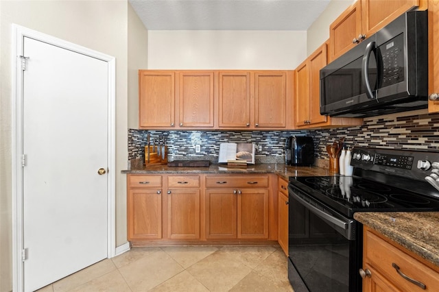 kitchen featuring black range with electric cooktop, decorative backsplash, dark stone counters, and light tile patterned flooring