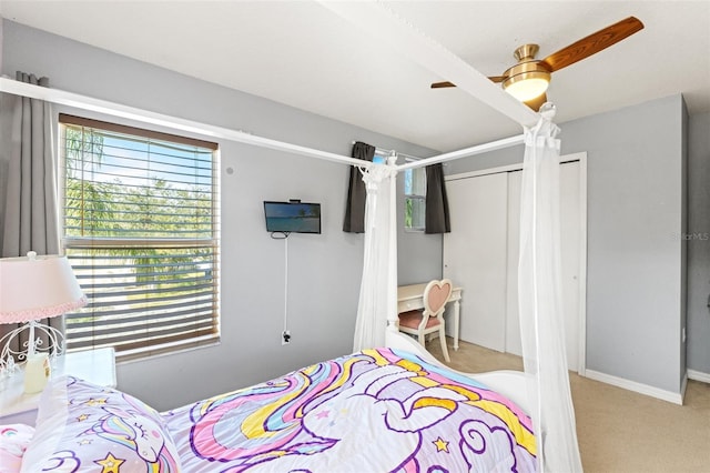 carpeted bedroom featuring ceiling fan