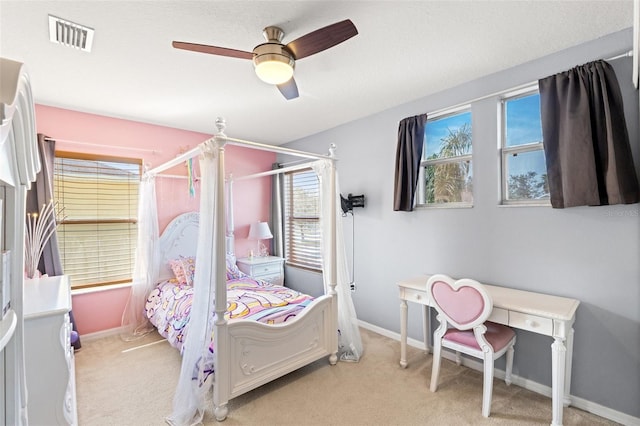 bedroom featuring ceiling fan and light colored carpet