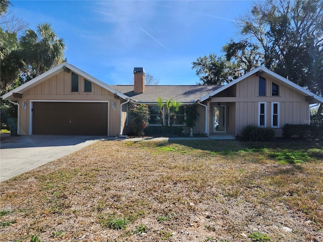 single story home featuring a garage and a front yard