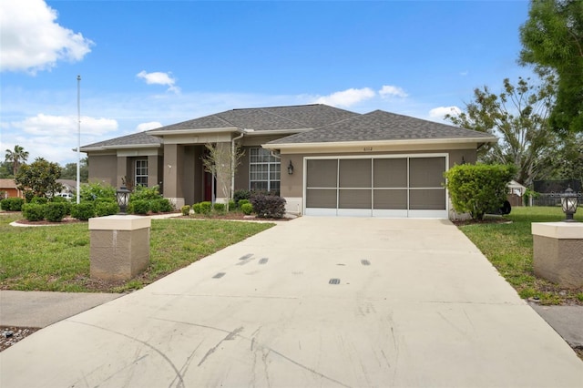 6112 Kinlock Ave, Spring Hill, FL 34608 - view of front of home featuring a front lawn, an attached garage, driveway, and stucco siding