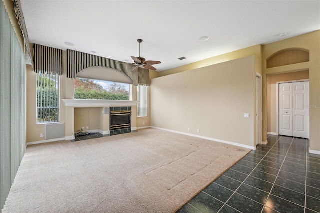 6112 Kinlock Ave, Spring Hill, FL 34608 - unfurnished living room with a ceiling fan, a fireplace, baseboards, and tile patterned flooring
