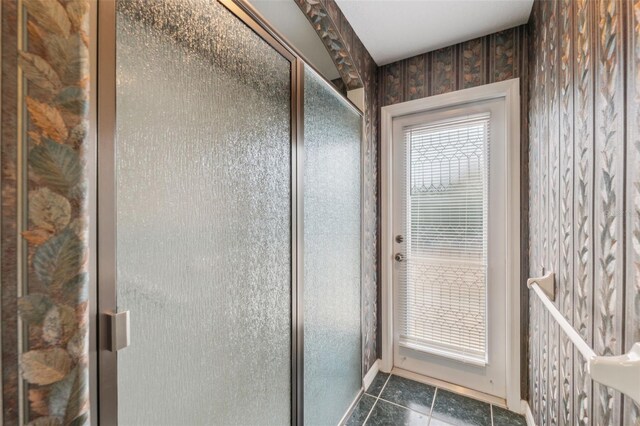 6112 Kinlock Ave, Spring Hill, FL 34608 - bathroom with tile patterned floors and a shower stall