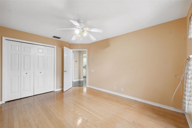 6112 Kinlock Ave, Spring Hill, FL 34608 - unfurnished bedroom with light wood-type flooring, baseboards, a closet, and a ceiling fan